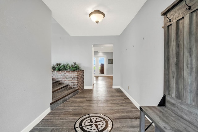 hallway with dark wood-type flooring