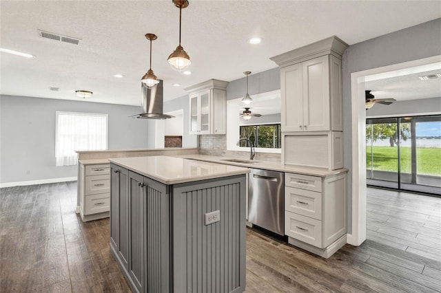 kitchen with stainless steel dishwasher, plenty of natural light, gray cabinetry, and sink