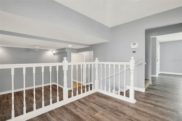 hall with dark wood-type flooring