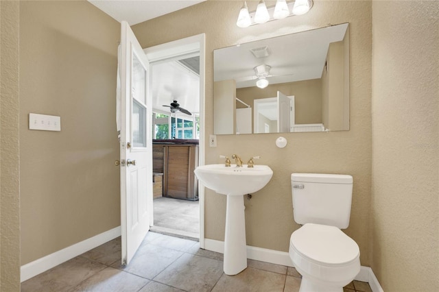 bathroom with tile patterned floors, toilet, and ceiling fan