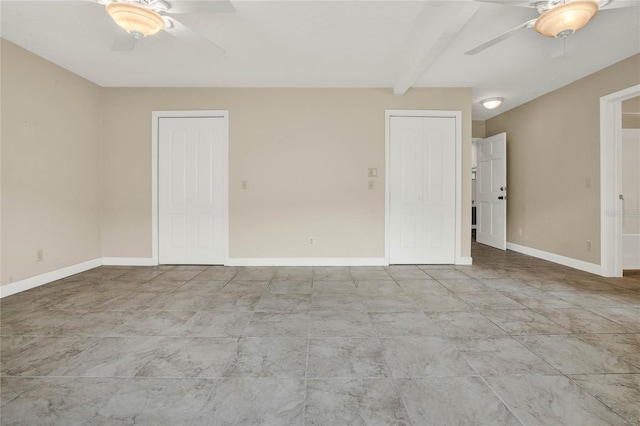 spare room featuring beamed ceiling and ceiling fan