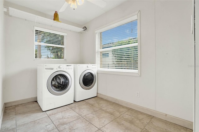 laundry room featuring light tile patterned floors, washer and clothes dryer, plenty of natural light, and ceiling fan