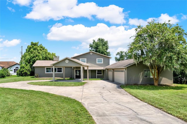 view of front of house featuring a garage and a front yard