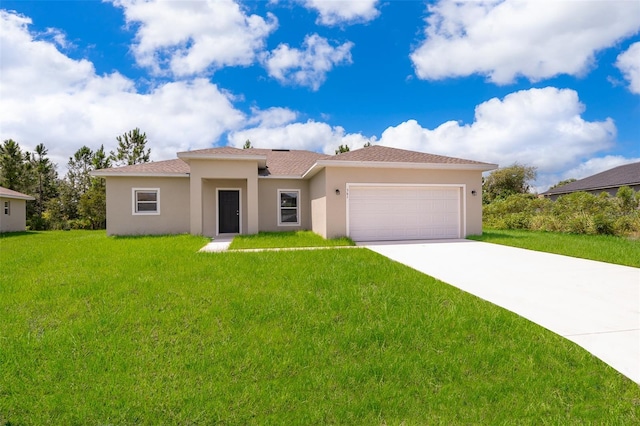 view of front of house featuring a garage and a front lawn