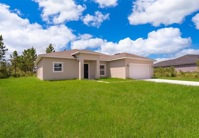 view of front of property with a garage and a front yard