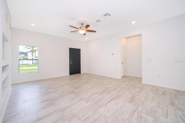 spare room featuring ceiling fan