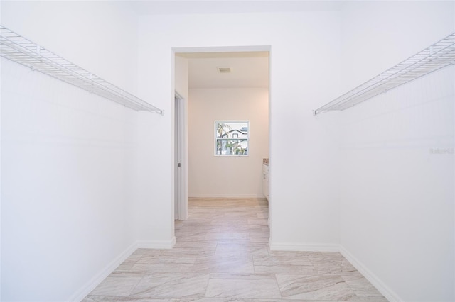 walk in closet featuring light tile patterned floors