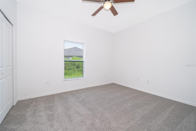 empty room with carpet and ceiling fan