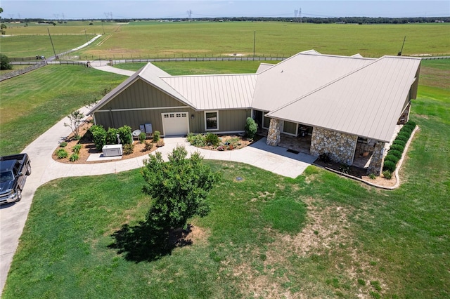 birds eye view of property featuring a rural view