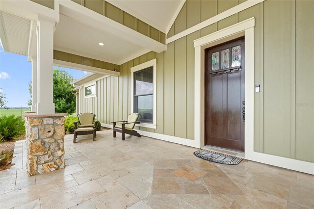 entrance to property featuring a patio area