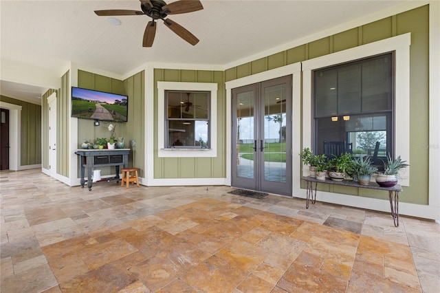 interior space with french doors and ceiling fan