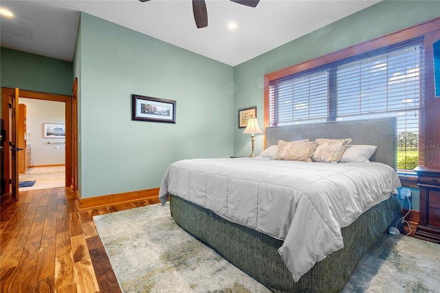 bedroom with hardwood / wood-style flooring and ceiling fan