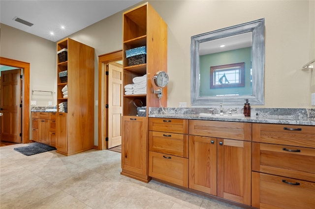 bathroom featuring tile patterned floors and vanity