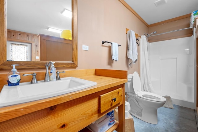 bathroom with vanity, curtained shower, crown molding, and toilet