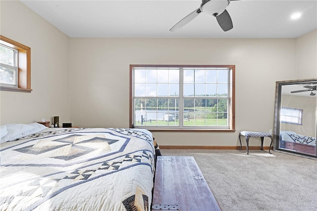 bedroom with ceiling fan and carpet flooring