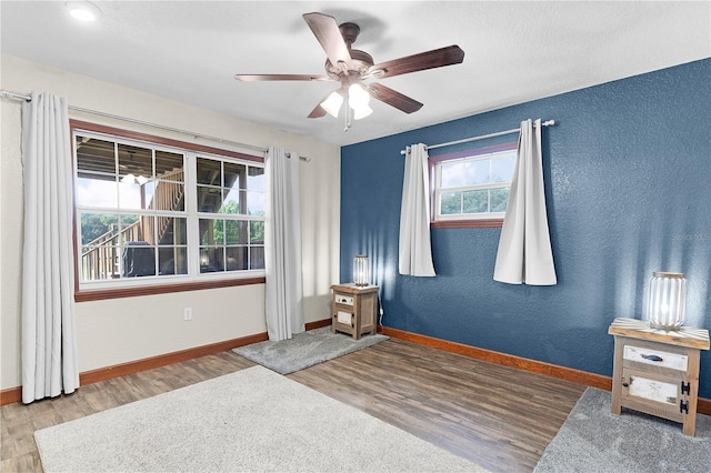 bedroom with light wood-type flooring and ceiling fan