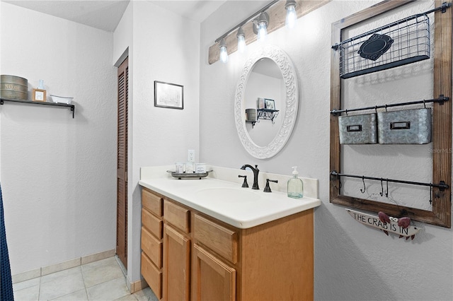 bathroom featuring tile patterned floors and vanity