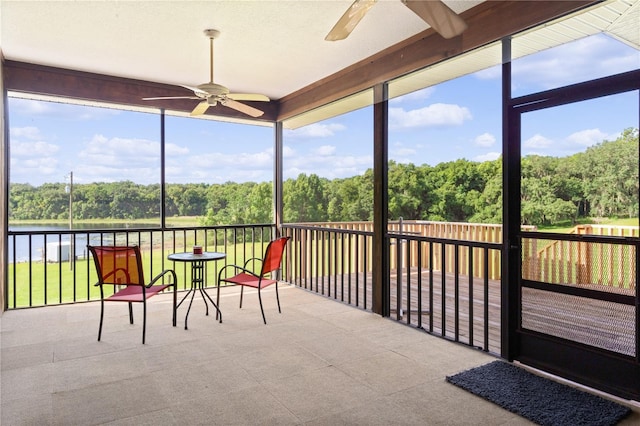 sunroom / solarium with a wealth of natural light and ceiling fan