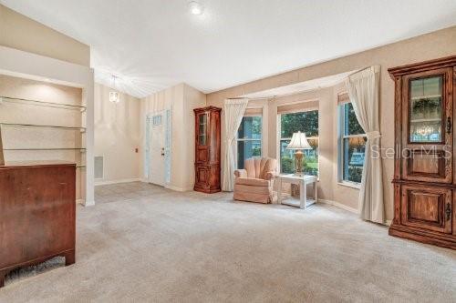 living area with light colored carpet