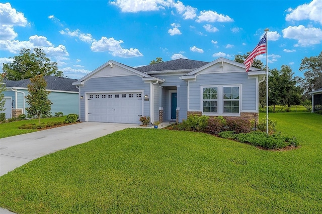 view of front of home with a garage and a front lawn