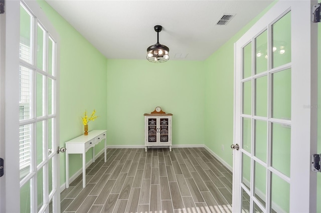 interior space with a wealth of natural light and wood-type flooring