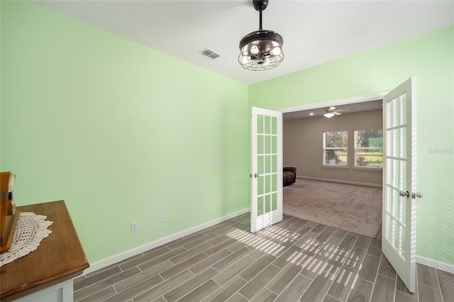 interior space featuring ceiling fan and french doors