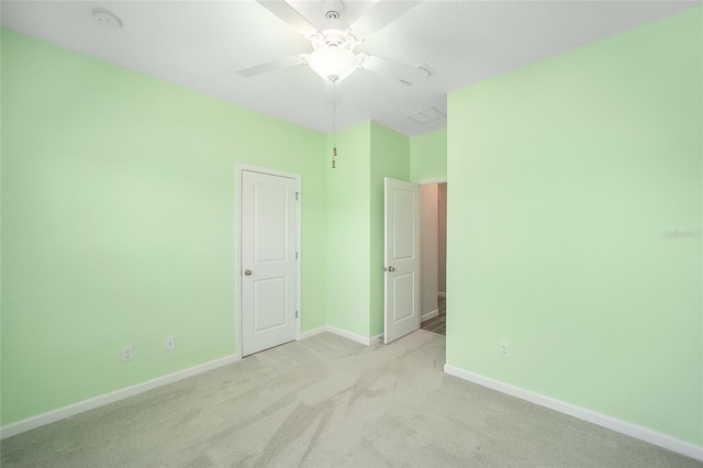 carpeted empty room with ceiling fan