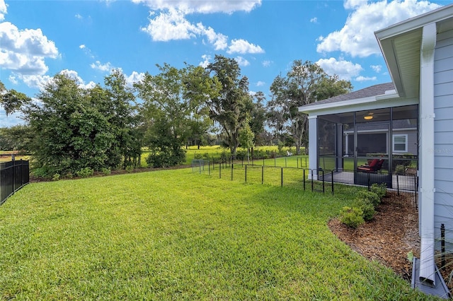 view of yard featuring a sunroom