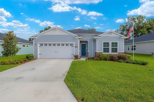 view of front of house with a front lawn and a garage