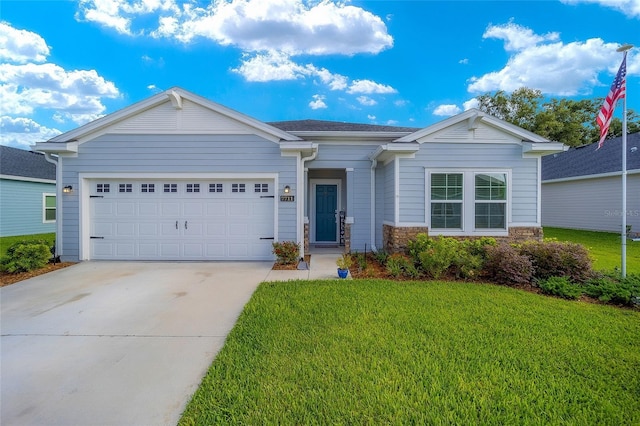 single story home featuring a front yard and a garage