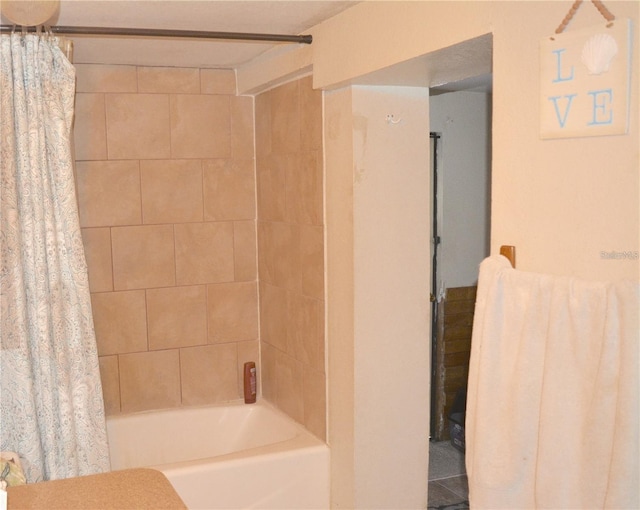 bathroom featuring shower / bathtub combination with curtain