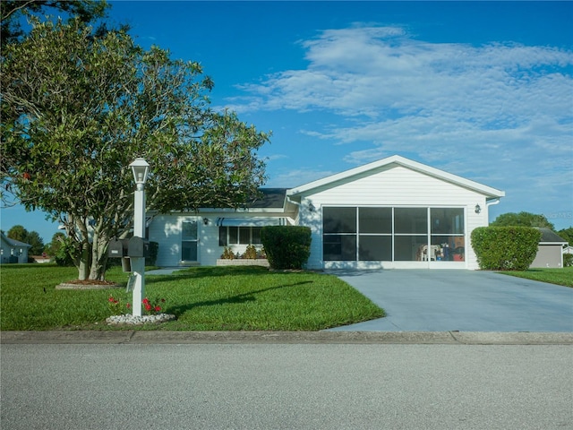 view of front facade with a garage and a front yard