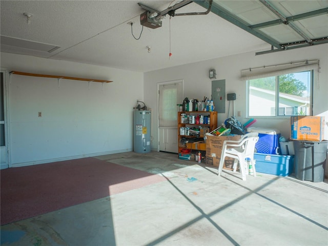 garage with a garage door opener, electric water heater, and electric panel