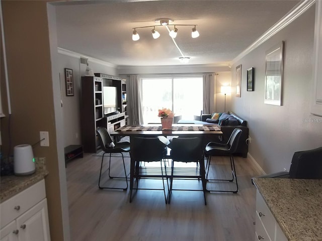 dining room with crown molding and dark wood-type flooring