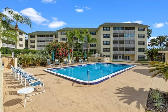 view of swimming pool with a patio area