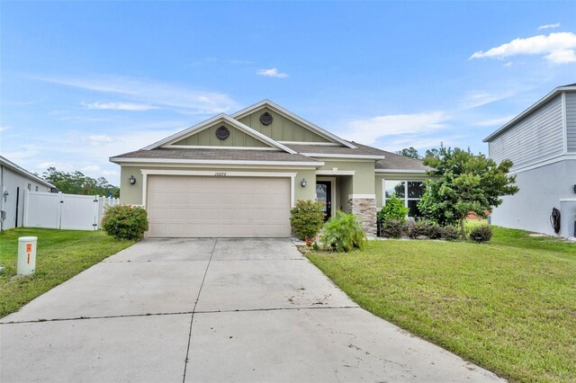 view of front of property featuring a garage and a front yard