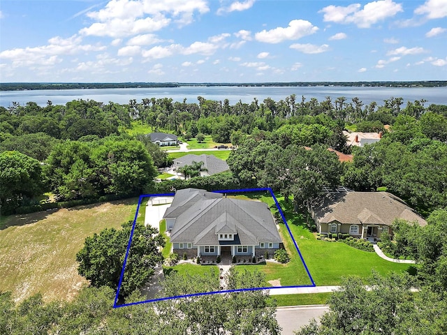 birds eye view of property with a water view