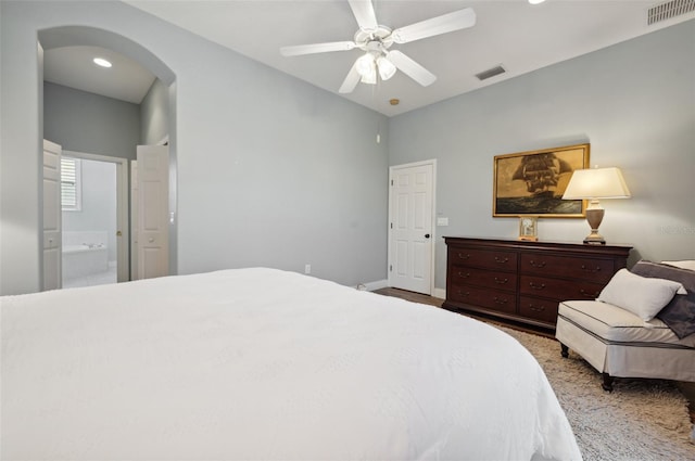 bedroom featuring ceiling fan and connected bathroom