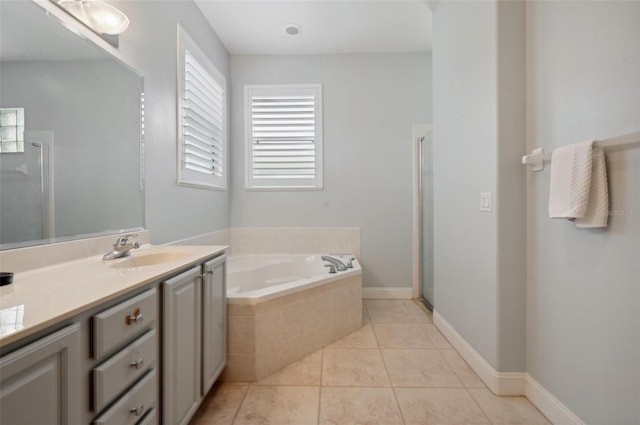 bathroom with vanity, tile patterned floors, and independent shower and bath