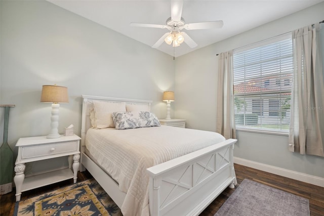 bedroom with dark wood-type flooring and ceiling fan