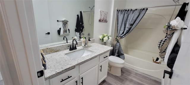 full bathroom with toilet, vanity, shower / bath combo with shower curtain, and hardwood / wood-style floors