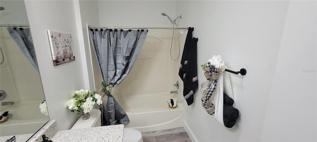 full bathroom with toilet, vanity, and shower / bath combo with shower curtain