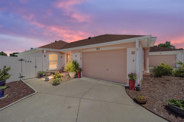 ranch-style home featuring a garage