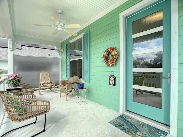 sunroom / solarium with ceiling fan