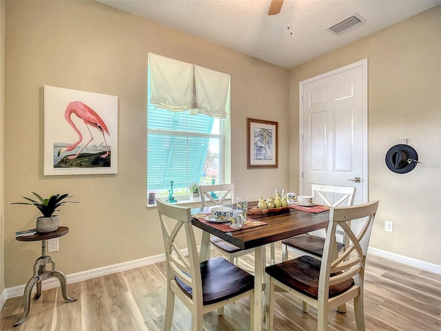 dining area featuring ceiling fan and light hardwood / wood-style flooring