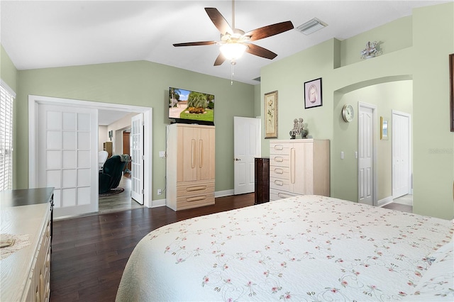 bedroom with lofted ceiling, dark hardwood / wood-style floors, and ceiling fan