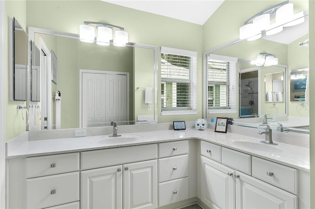 bathroom featuring vanity and a shower