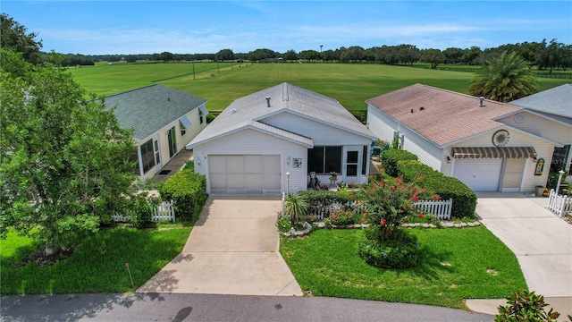 ranch-style house with a garage and a front yard