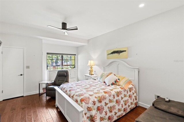 bedroom featuring dark hardwood / wood-style floors and ceiling fan