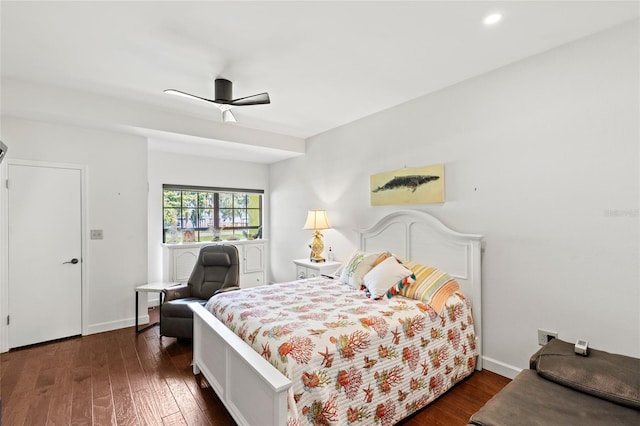 bedroom with ceiling fan and dark hardwood / wood-style flooring